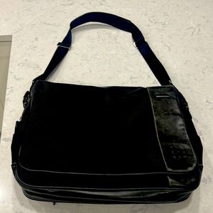 Tumi Messenger Bag many pockets will fit laptop. Used condition